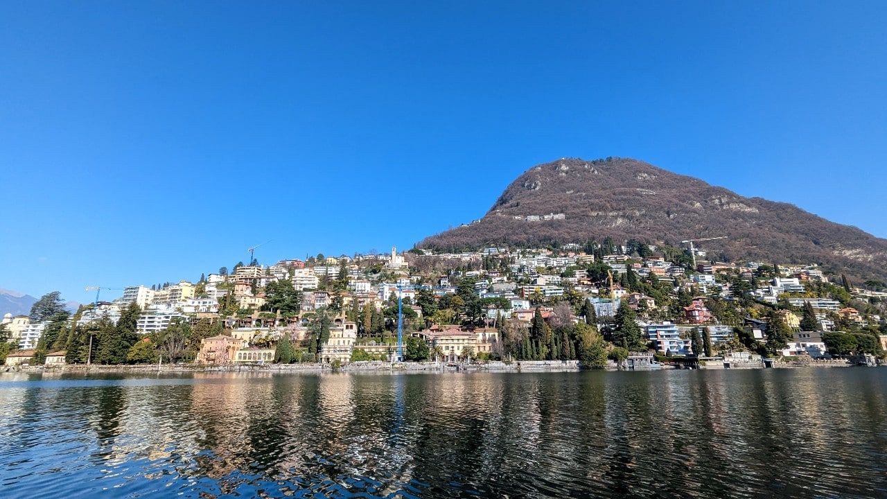 Boat and lakeside scenery on Lake Lugano near Gandria